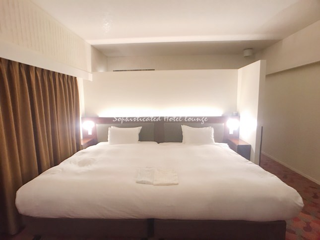 沖縄かりゆしビーチリゾート・オーシャンスパの客室ベッド