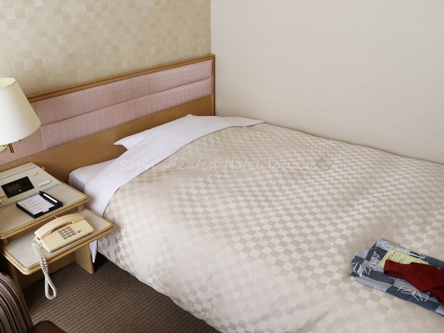 パレスホテル掛川のシングルルームの客室ベッド